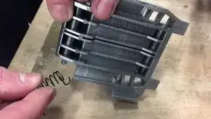 Place the spring on the new part.