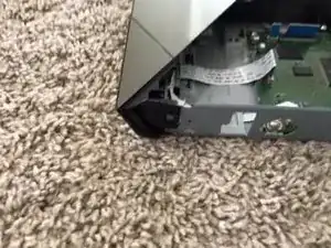 Remove the clasps on the side of the device