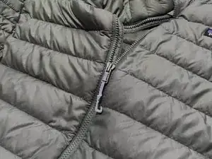 To take off a damaged zipper pull, do these same steps in reverse.
